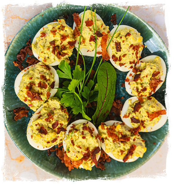 EGGS STUFFED WITH AVOCADO PASTE WITH CRISPY BACON