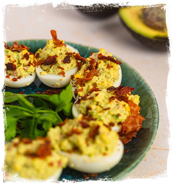 EGGS STUFFED WITH AVOCADO PASTE WITH CRISPY BACON