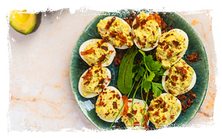 EGGS STUFFED WITH AVOCADO PASTE WITH CRISPY BACON